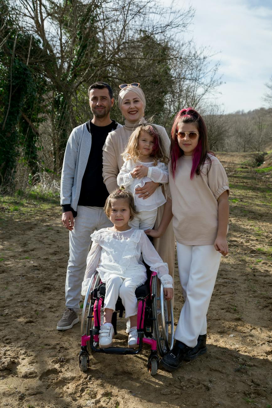 cheerful family with girl in wheelchair